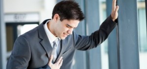 young businessman having chest pain